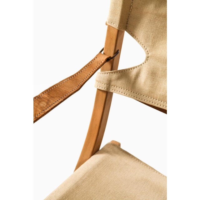 This pair of safari easy chairs, designed by poul hundevad and produced by vamdrup stolefabrik in denmark during the...