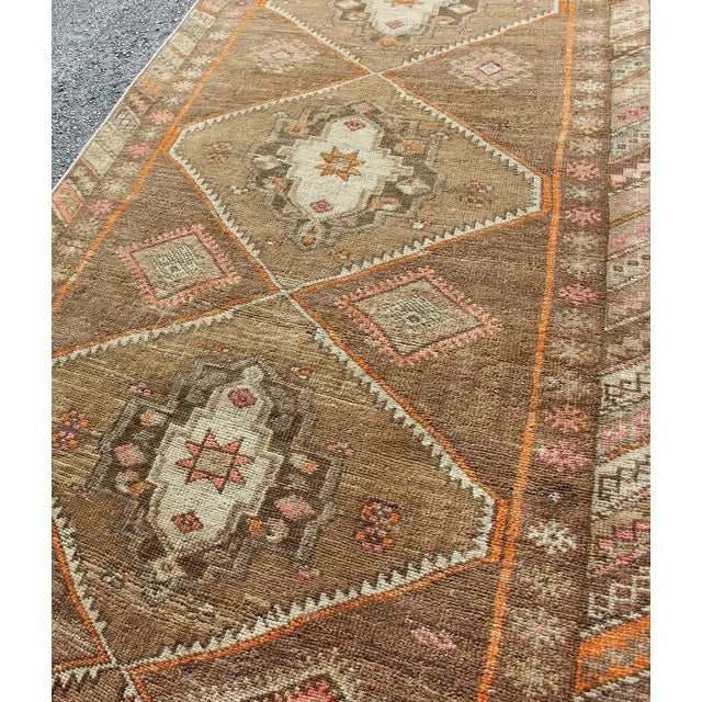 Mid 20th Century Vintage Hand Knotted Turkish Oushak Runner With Tribal Medallions in Earthy Tones For Sale - Image 5 of 11