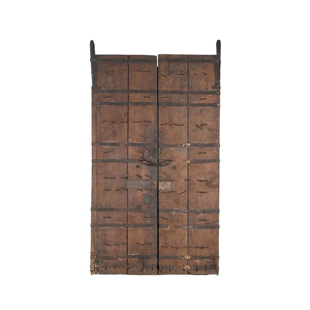 This Antique Indian Painted Teakwood Door is handcrafted from solid teakwood, featuring a distinctive grid-panel design...
