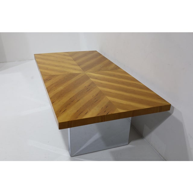 A beautiful and substantial dining table designed by Milo Baughman for Thayer Coggin in book matched walnut with a...