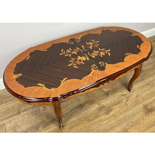 A stunning Vintage Italian coffee table , beautifully crafted with an elegant inlaid top and a rich high gloss finish that...