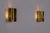 Pair of solid brass wall sconces with offset fins, Swedish work from the 1960s. The deconstructed cylindrical...