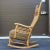 A rare rocking version of the high back sculptural chair often attributed to Edward Wormley.