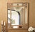 Make a dramatic statement with this ornate gold-finished wall mirror, featuring elaborate scrolling details inspired by...
