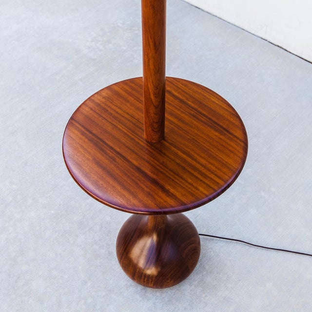 A newly restored Scandinavian modern floor lamp with integrated side table, produced in Denmark c. 1960s. The lamp is...
