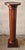 A 20th Century Mahogany Ionic Order Style Column-Form Pedestal Measures 10.5" in width, 10.5" in depth and stands 40.25"...