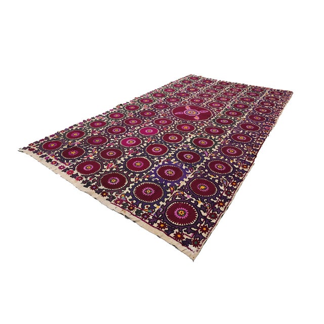 Suzani from Khojent, a city in Northern Tajikistan, closely resemble Tashkent embroidery with their strict rows of...