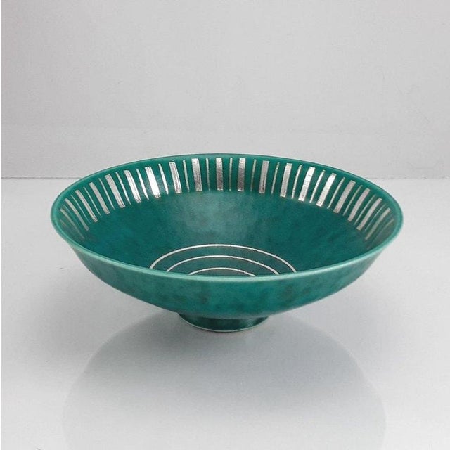 A refined Argenta stoneware bowl designed by Wilhelm Kåge for Gustavsberg, Sweden, produced during the 1940s. The bowl...