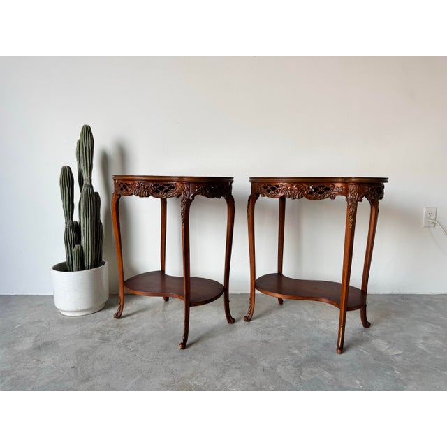 Available for sale this stunning pair of antique Louis XV-style kidney-shaped end tables or nightstands, featuring...