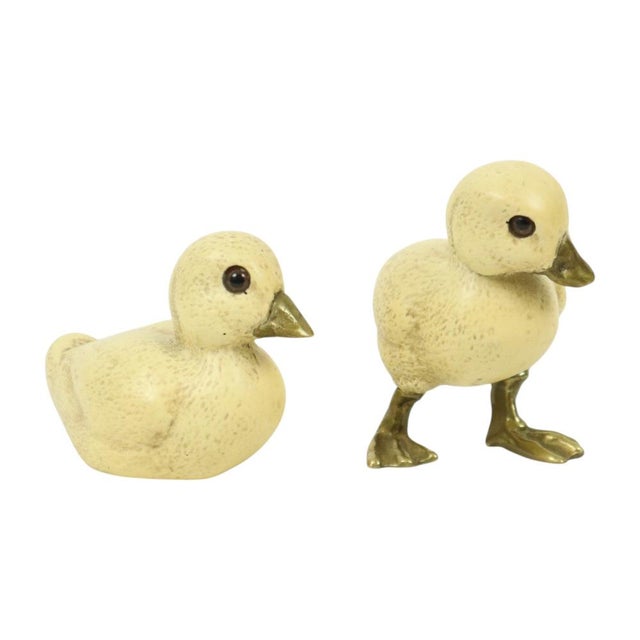 Cute vintage duck figurines crafted from resin; the legs and beak are brass and the eyes are made of glass. Vintage art...