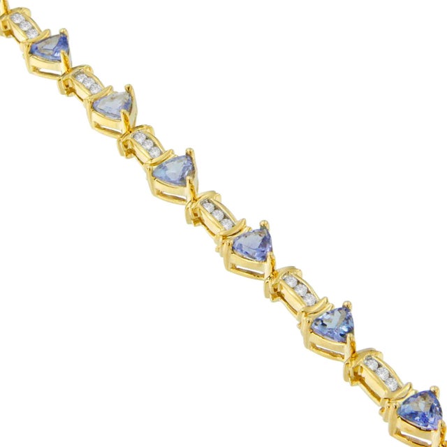 Unveil timeless elegance with this exquisite bracelet, masterfully crafted from radiant 14K yellow gold. Each of the...
