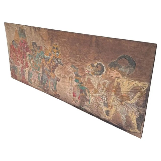 This exquisite antique teak wood panel hails from the culturally rich island of Java, Indonesia, and features a...