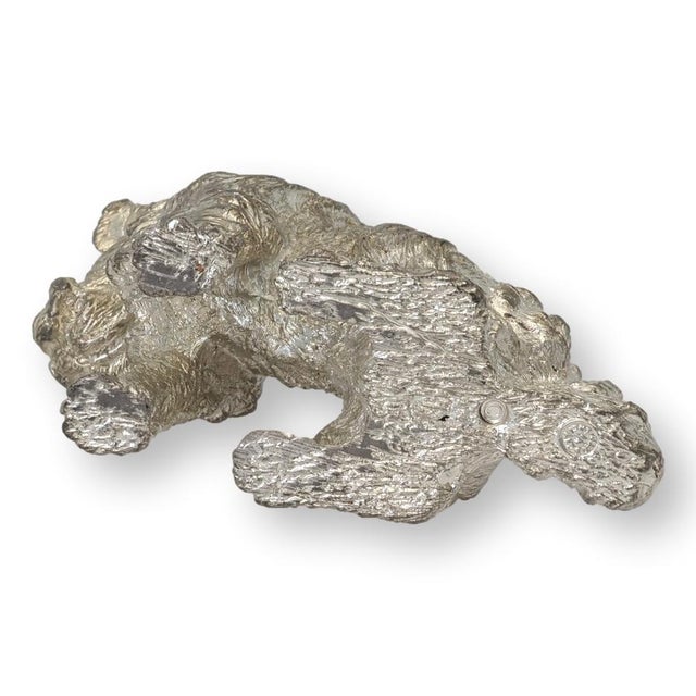 Silver plated wirehaired terrier figure, made in England. Finely cast with expressive detailing throughout the textured...