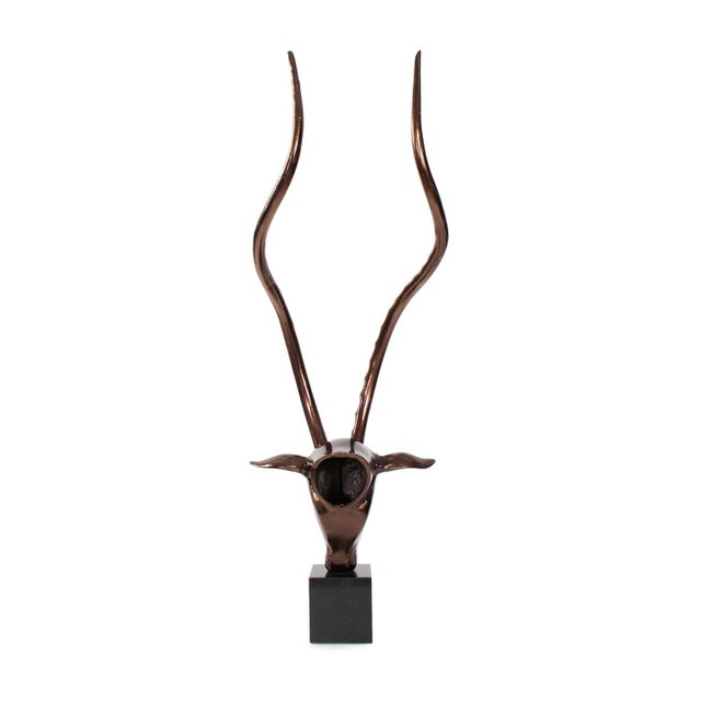 Inspired by the majestic Kenyan antelope, this sculpture beautifully recreates its iconic, curved horns. Cast in a sleek,...