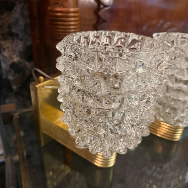 A pair of wall lights designed and manufactured in Italy in the style of Barovier, which invented this particular glass...