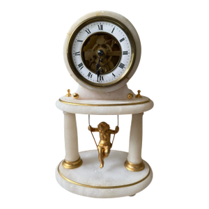 Antique French Neoclassical Alabaster Gilt Mantel Clock. Figural Putti Cherub Swing Pendulum in Brass. Has Visible Escapement.