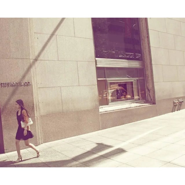 Tiffanys' by Stuart Christian Möller A young woman passes by the infamous diamond and jewellery store, Tiffany's in New...