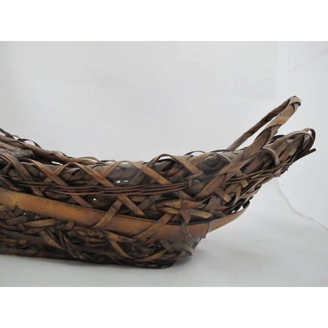 Antique Japanese bamboo Ikebana flower basket designed in a traditional boat shape known as Funagata. Handwoven in natural...