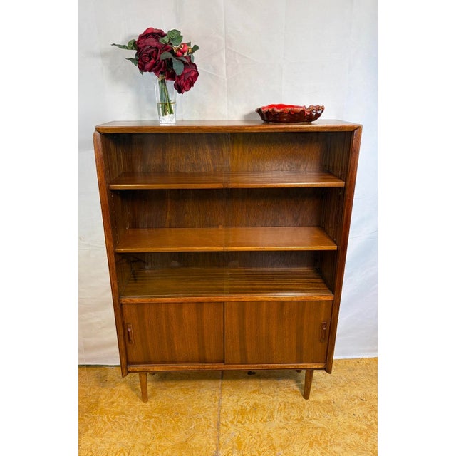 Mid-Century Modern Teak Bookcase by Herbert E. Gibbs, 1960, in Restored conditions. Designed 1960 to 1969 This piece has...