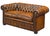 A fine Chesterfield two-seater sofa upholstered in original patinated chestnut leather from Edwardian era England -...