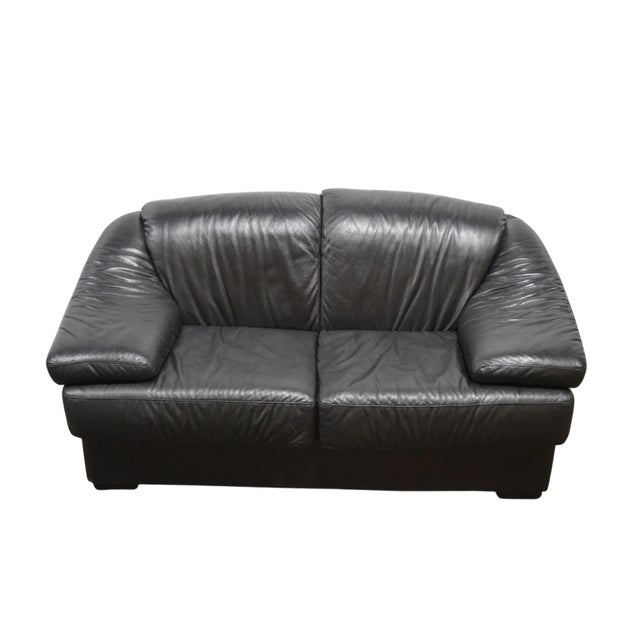 A very 1980's/1990's Italian leather sofa / loveseat. The sofa is attributed to Natuzzi/Salotti. A comfortable and well...