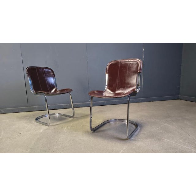 Set of 6 dining chairs produced by Cidue, often attributed to Willy Rizzo. The chairs have a beautifully shaped chrome...