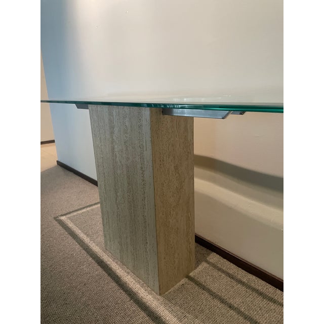 Add a touch of elegance to your home with this travertine, chrome, and glass console table from the 1970s (attributed to...