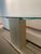Add a touch of elegance to your home with this travertine, chrome, and glass console table from the 1970s (attributed to...