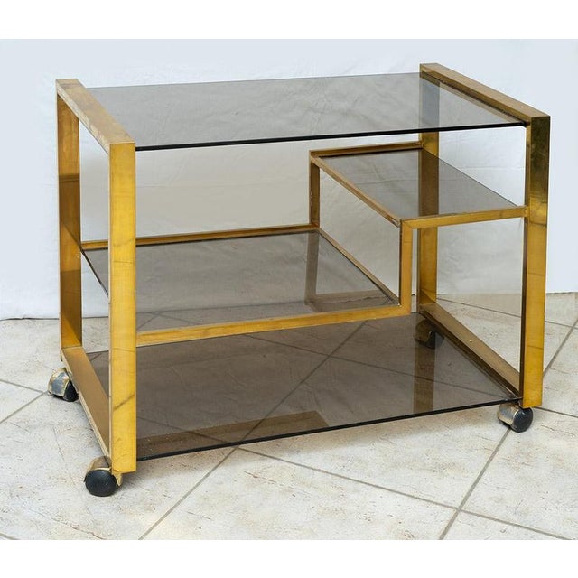 Brass and etched crystal multi-shelf cart belonging to the early 1970s Provenance: Italy. Condition: Good Condition....