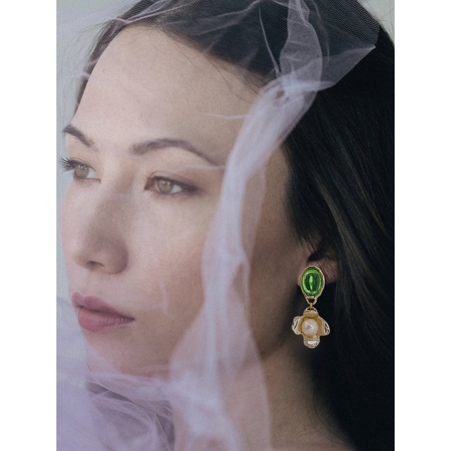 With playful colors, pearls, and hand-carved flowers these are super lightweight and can be worn day to night. Materials:...