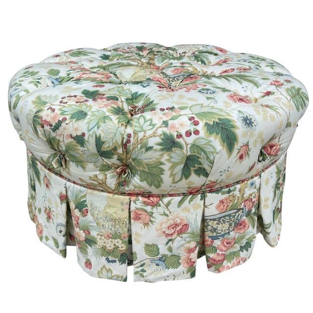 A beautifully upholstered vintage Hickory Chair round ottoman featuring deep tufting, tailored skirted sides, and a...