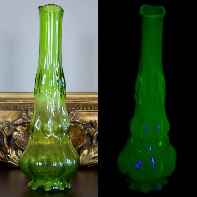 Striking vintage Kanawha Glass swung vase in rare dark uranium glass, featuring an elegant elongated form created through...