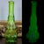 Striking vintage Kanawha Glass swung vase in rare dark uranium glass, featuring an elegant elongated form created through...