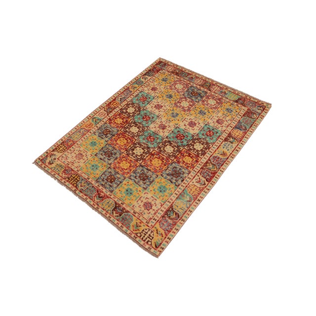 A mesmerizing addition to any decor, this exhilarating hand-knotted rug featuring exquisite coloration in an intricate...