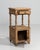Rendered in warm French oak, this refined side table speaks to the quiet sophistication of late nineteenth-century...