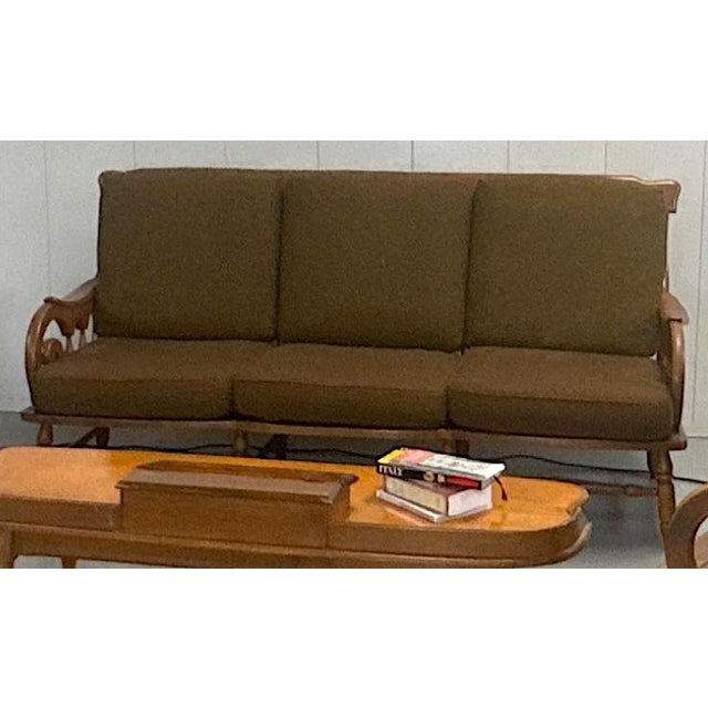 This genuine Haywood-Wakefield #497-74 maple sofa captures the sculptural warmth and craftsmanship that define American...