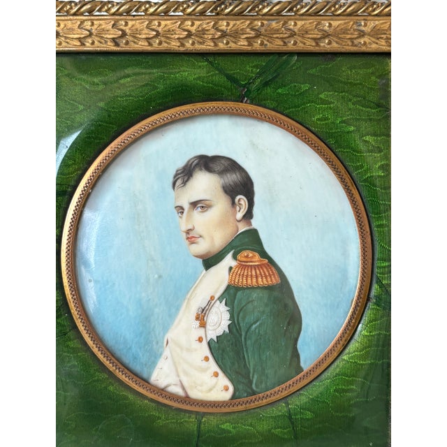 A fine antique French miniature portrait depicting Napoleon Bonaparte in imperial uniform, finely rendered in profile with...