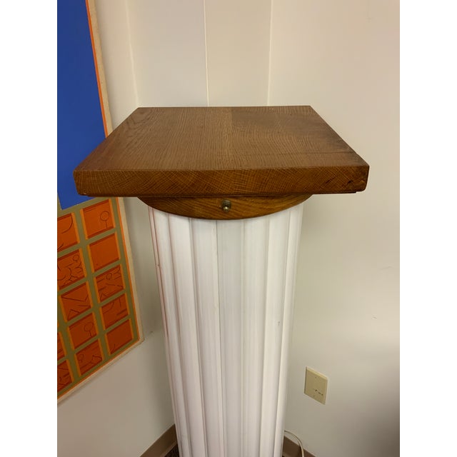Artisan piece, Post Modern fluorescent light tube column/pedestal. Multi colored when lit. Oak cap and base, 51” tall....