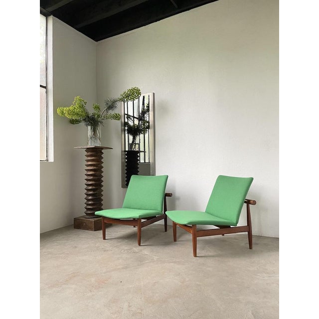 Pair of “japan” model fireside chairs or armchairs by finn juhl for france & son editions. iconic and rare fd 137 model,...
