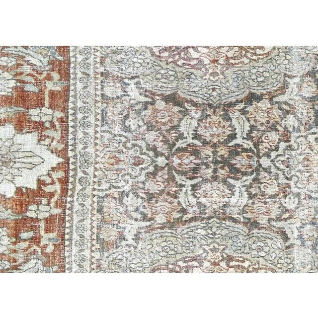 This Semi Antique Persian Kerman Rug, measuring 6'8" by 9'6", is handwoven in Iran's Kerman region and has been carefully...