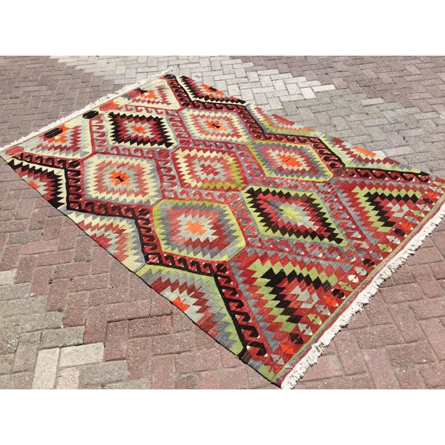 This beautiful, vintage, handwoven kilim is approximately 60 years old. It is handmade, of very fine quality hand spun...