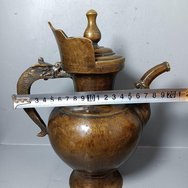 Make a bold statement in your home with this impressive vintage-style Chinese brass ewer. Featuring a substantial, bulbous...