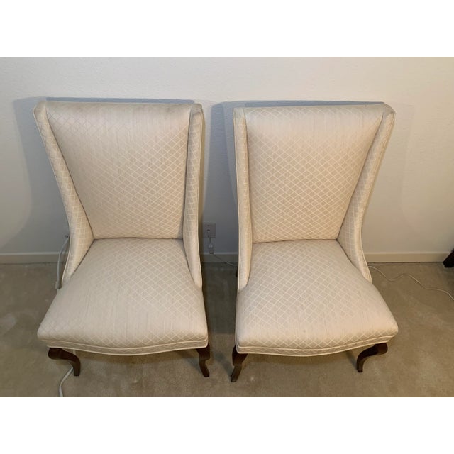 Vintage walnut dining arm chairs upholstered in diamond pattern
