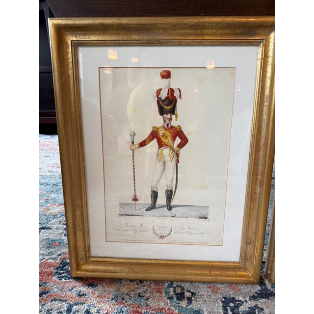 Elegant pair of soldier prints displayed in gilt wood frames. Great to dress up a more formal area or to add interest to a...