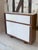 Sideboard with sliding doors. Mahogany frame with white melamine finish. Designed by Le Corbusier for the "Cité Radieuse"...