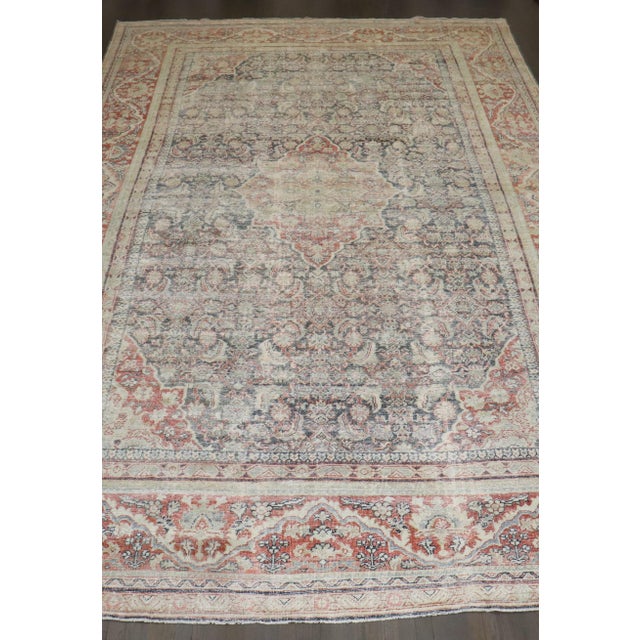 An early 20th Century worn Oversize Persian Mahal Carpet