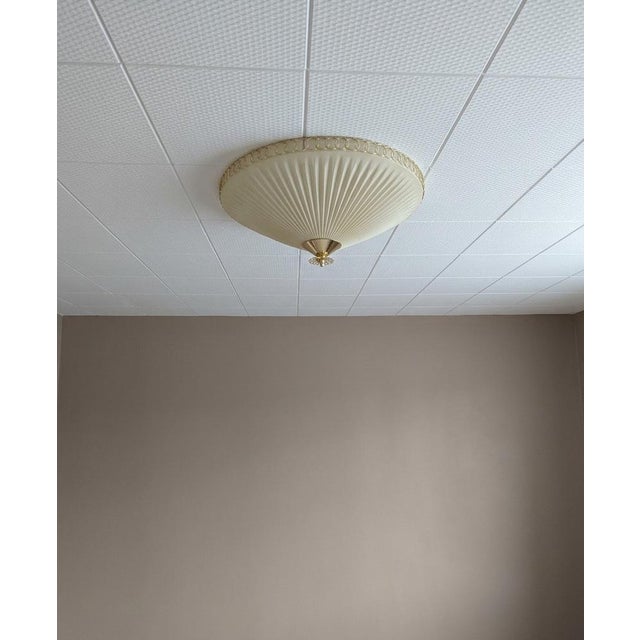 The ceiling lamp was manufactured by Oy Valinte in Finland in the 1950s. Model number 1241. This is a similar model to...