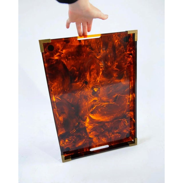 Acrylic serving tray in faux tortoiseshell, brass corners, Italy, circa 1960s. Attributed to Christian Dior Home...