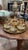 Beautiful vintage Turkish tea service featuring an ornate brass tray with a decorative carrying frame, matching teapot,...