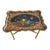 About English scalloped Tole tray with decorative Floral and shell motif resting on a painted foldable faux bamboo stand...